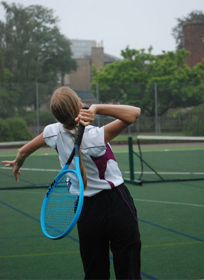 BGS student playing tennis 